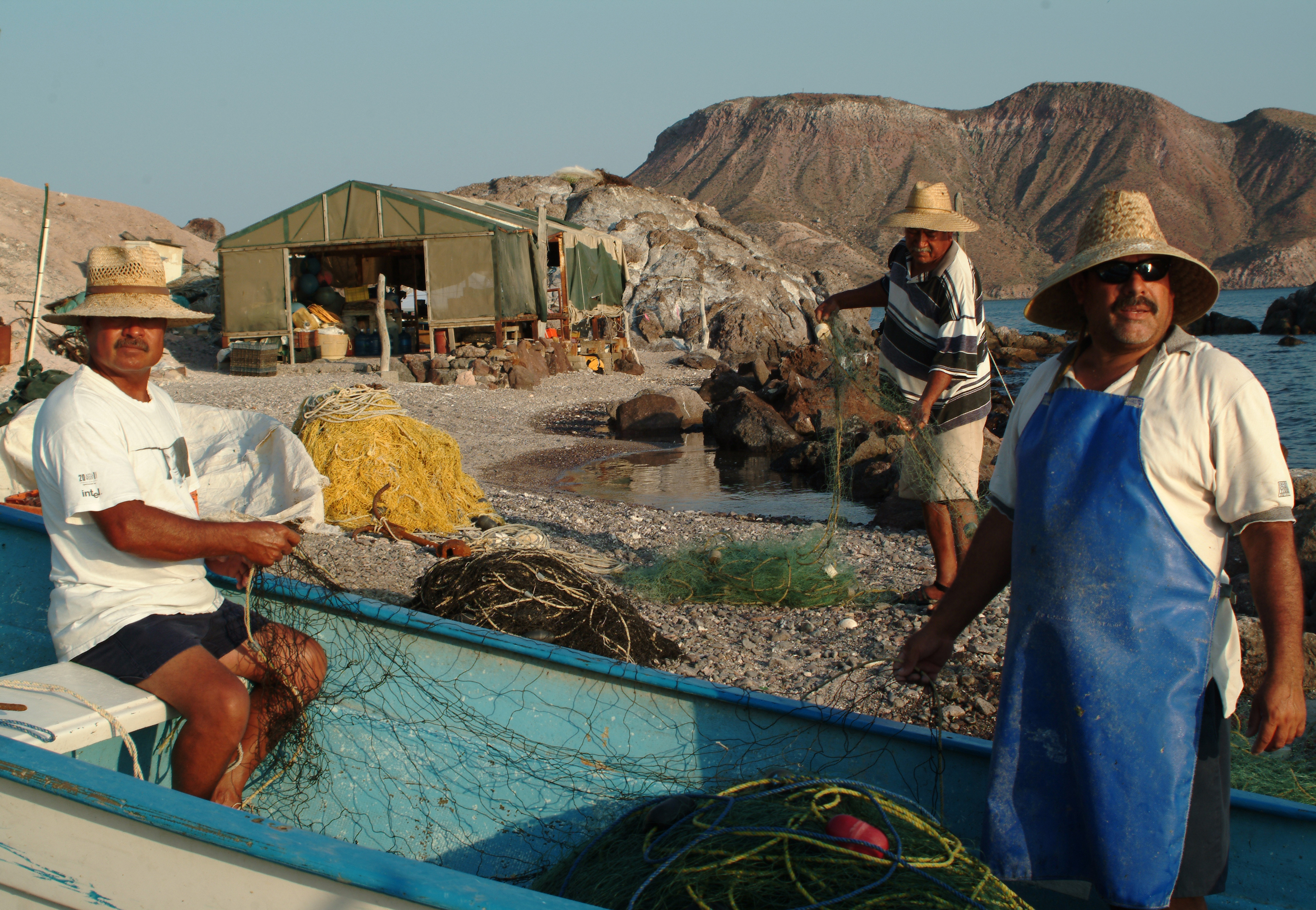 Every day the fishermen had to mend their nets before setting out.