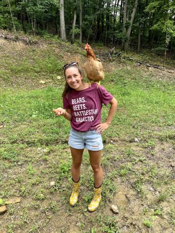 Rachel Miller with a chicken on her shoulder